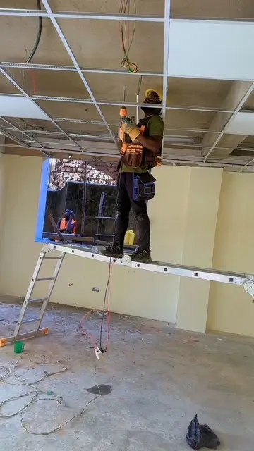 Licensed electrician working on electrical systems in Kampala